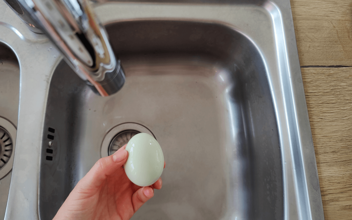 Washing egg in the sink