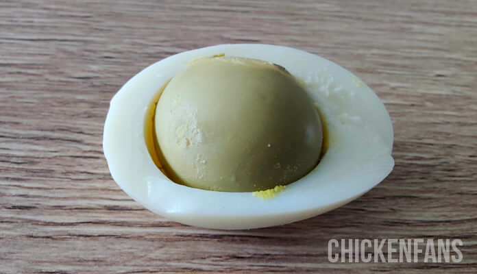 egg containing a green egg yolk