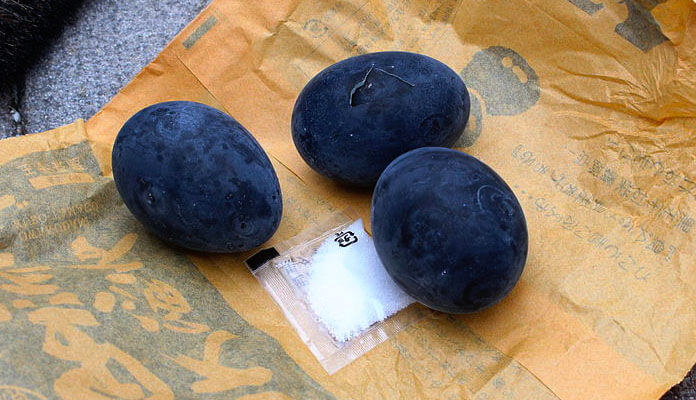 black boiled eggs of hakone on brown paper