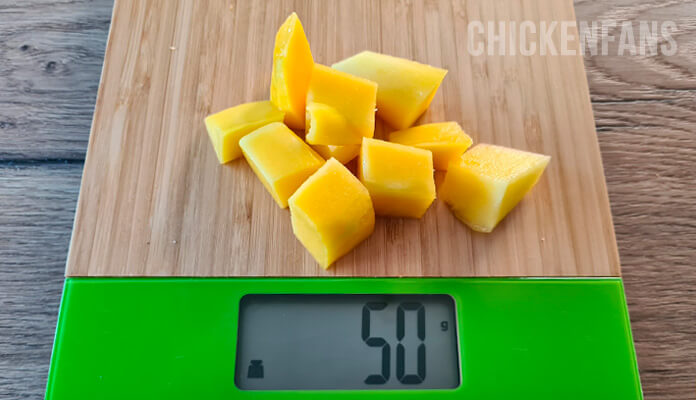 50 grams of mango flesh on a scale