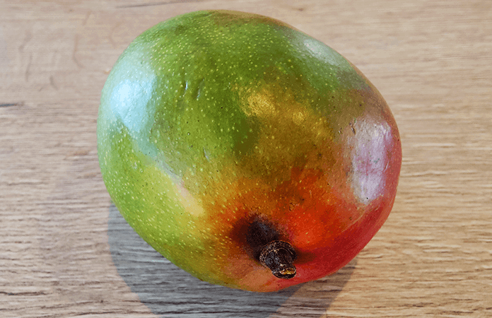 a whole ripe mango