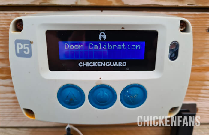 Chickenguard automatic chicken coop door opening unit in automatic door calibration mode