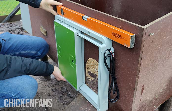 The installation of the door of the Omlet Auto door