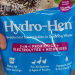 man holding hydro-hen, a probiotics for chickens