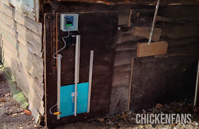 a vevor door attached to a chicken coop