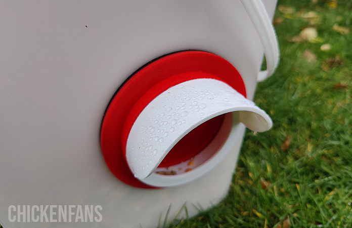 water on the rain cover of the rentacoop feeder. the feed stays dry at all times