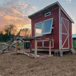 a red colored chicken coop