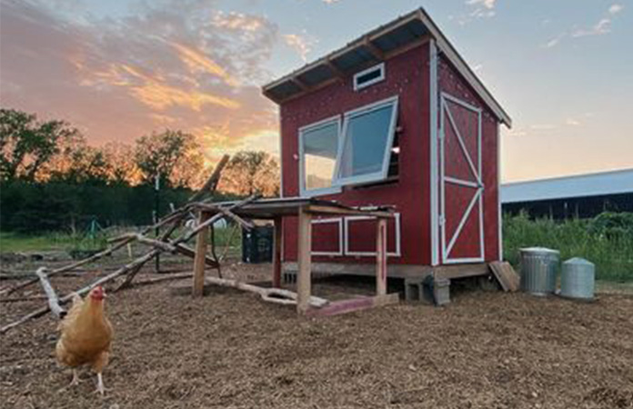 a red colored chicken coop